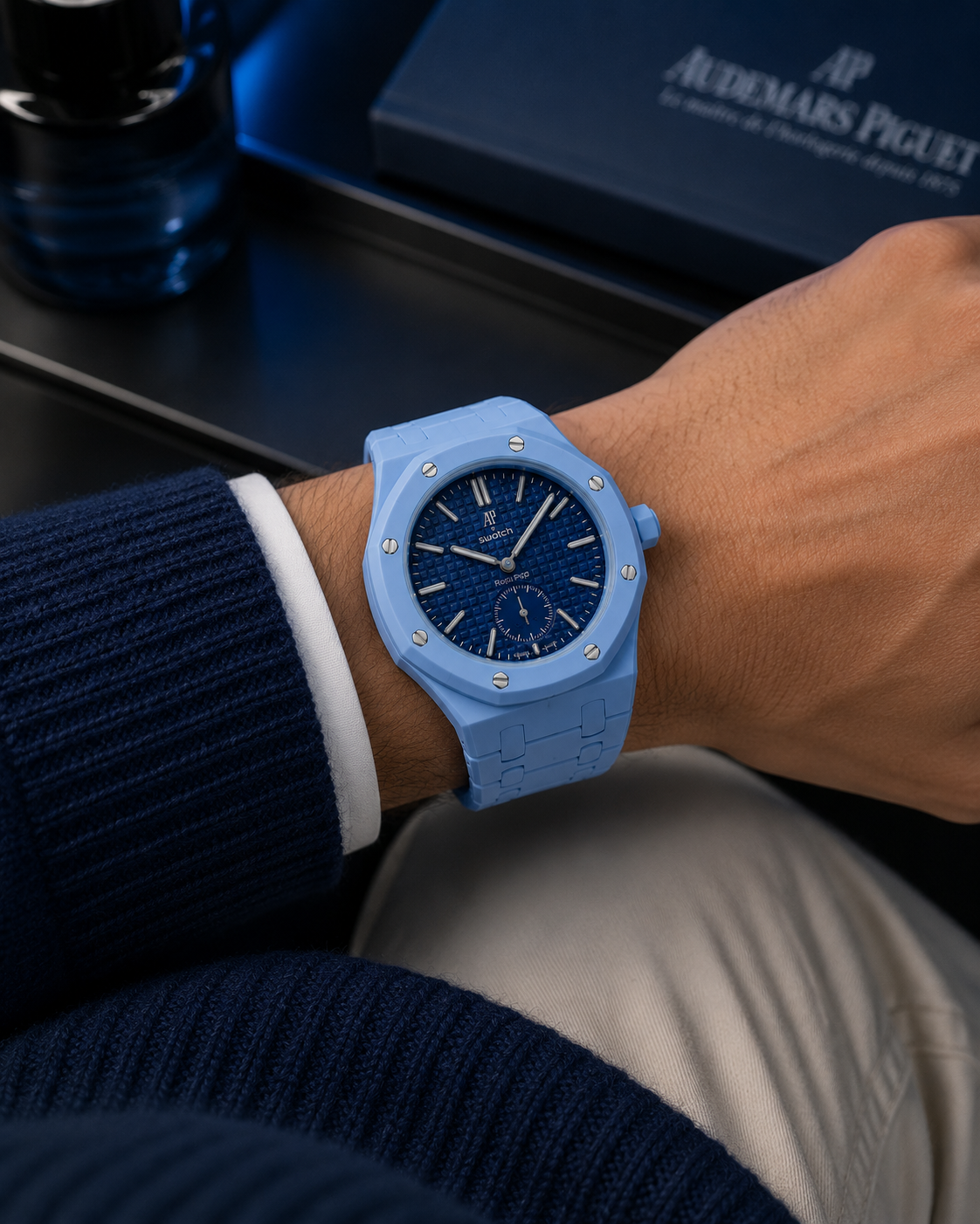 Sky Blue concept worn on the wrist with a navy sweater